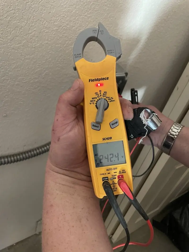 Voltage testing with clamp meter during Generator Installation in Saugatuck